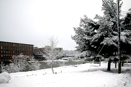 picturesque view of winooski river in winter